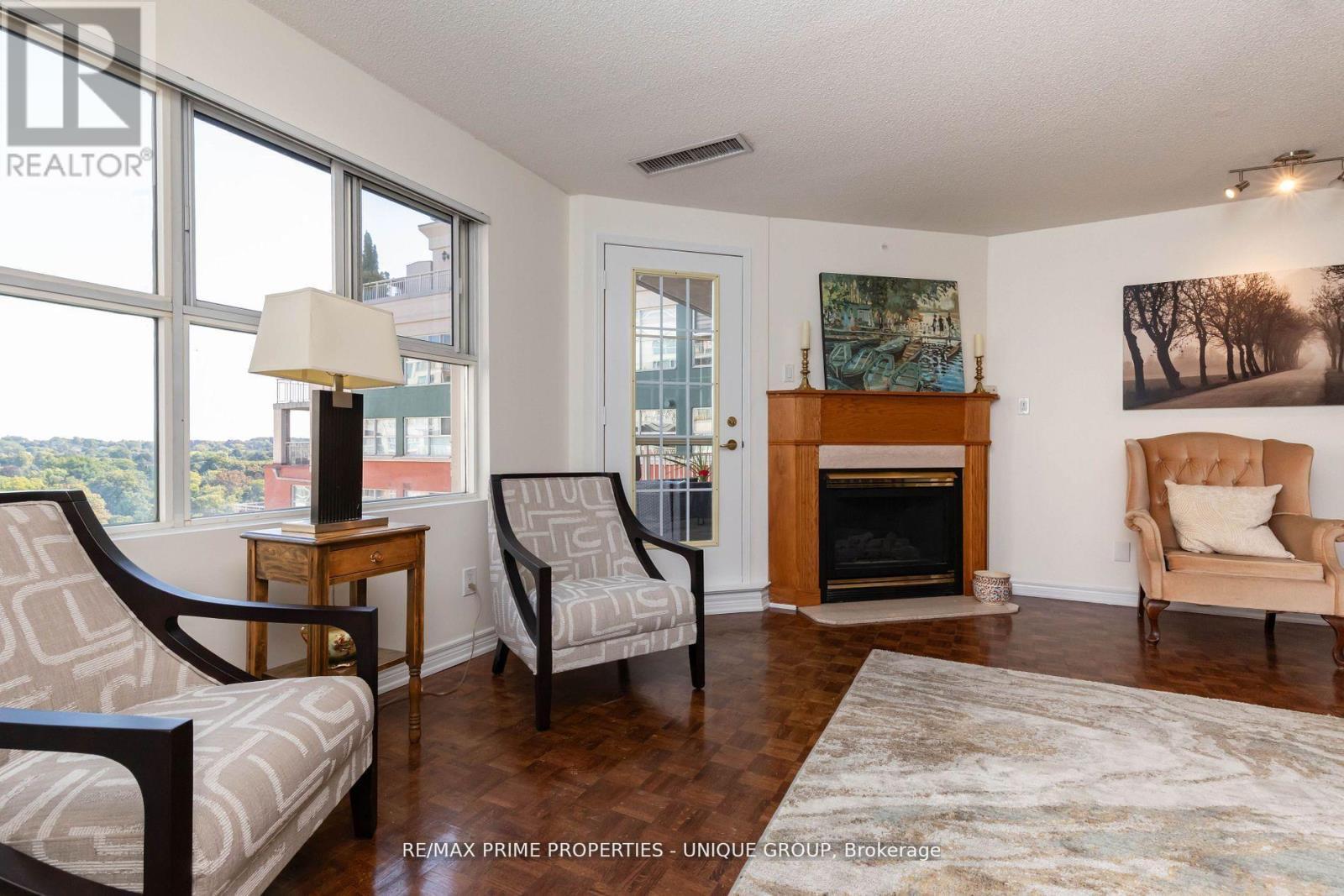 808 - 18 Concorde Place, Toronto, ON - Indoor Photo Showing Living Room With Fireplace