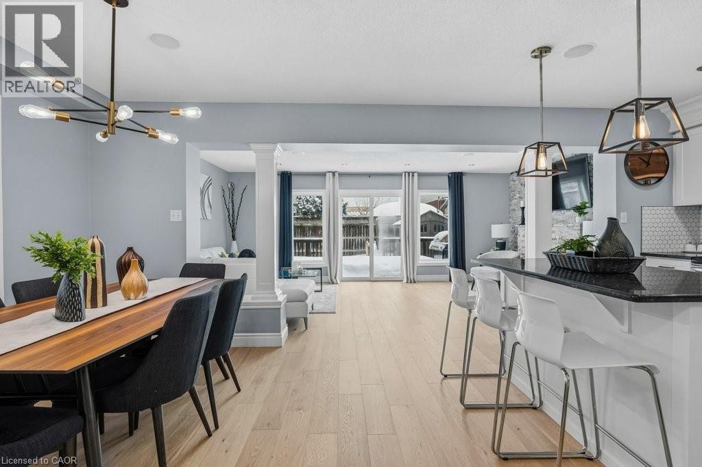 Stunning mainfloor with upgraded kitchen, new flooring, patio door walkout, and more! - 26 Helena Feasby Street, Kitchener, ON - Indoor Photo Showing Dining Room