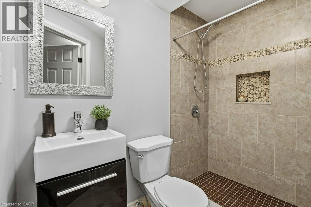 Fully finished basement with rec room and 3pc bath - 26 Helena Feasby Street, Kitchener, ON - Indoor Photo Showing Bathroom