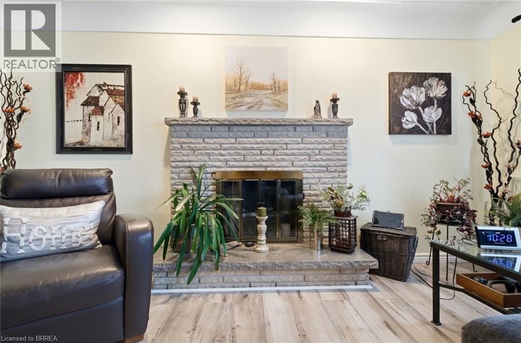 15 Talbot Street, Courtland, ON - Indoor Photo Showing Living Room With Fireplace