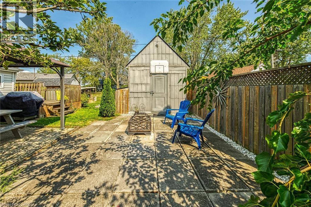 View of patio / terrace shed with fire wood storage at side - 17 Maple Lane, Rainham, ON - Outdoor With Deck Patio Veranda