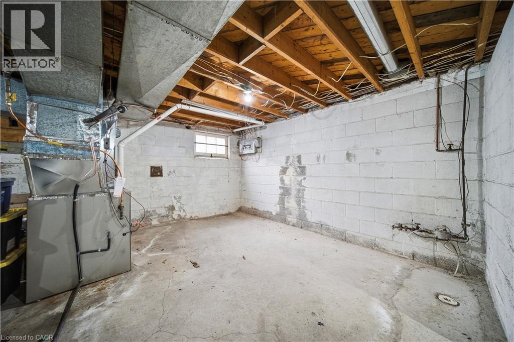 Below grade area with heating unit - 276 Lakeshore Road W, Oakville, ON - Indoor Photo Showing Basement