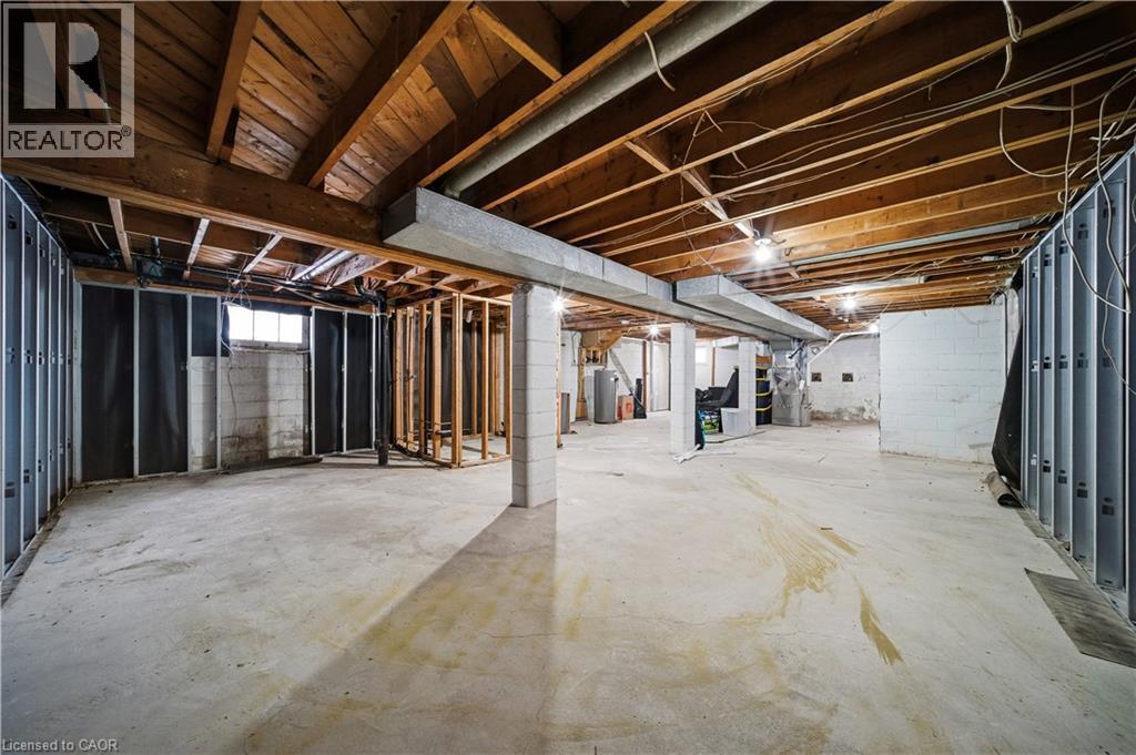 Unfinished below grade area featuring heating unit - 276 Lakeshore Road W, Oakville, ON - Indoor Photo Showing Basement