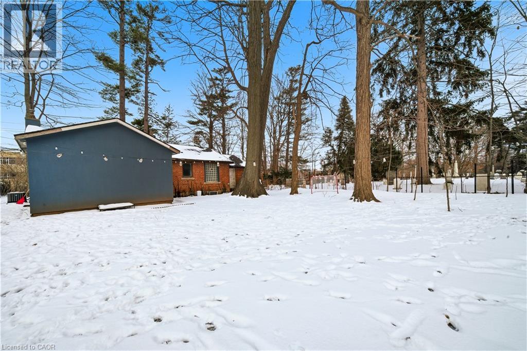 View of yard layered in snow - 276 Lakeshore Road W, Oakville, ON - Outdoor