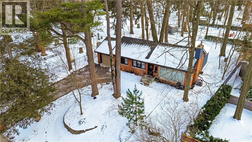 View of snow covered exterior with a chimney - 276 Lakeshore Road W, Oakville, ON - Outdoor
