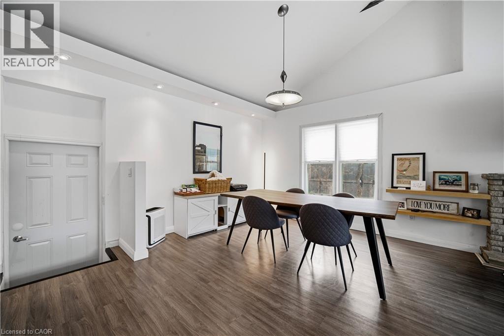 Office space featuring dark wood-type flooring, recessed lighting, and high vaulted ceiling - 276 Lakeshore Road W, Oakville, ON - Indoor