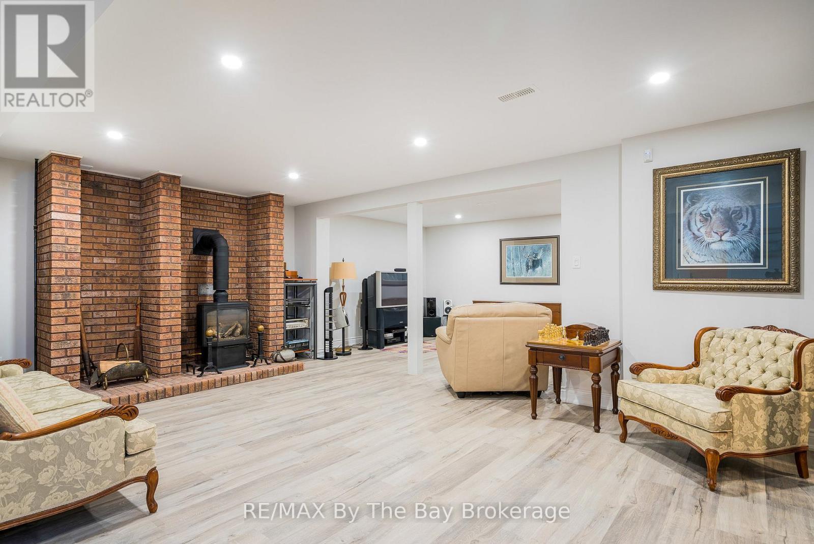 38 Willow Drive, Tiny, ON - Indoor With Fireplace