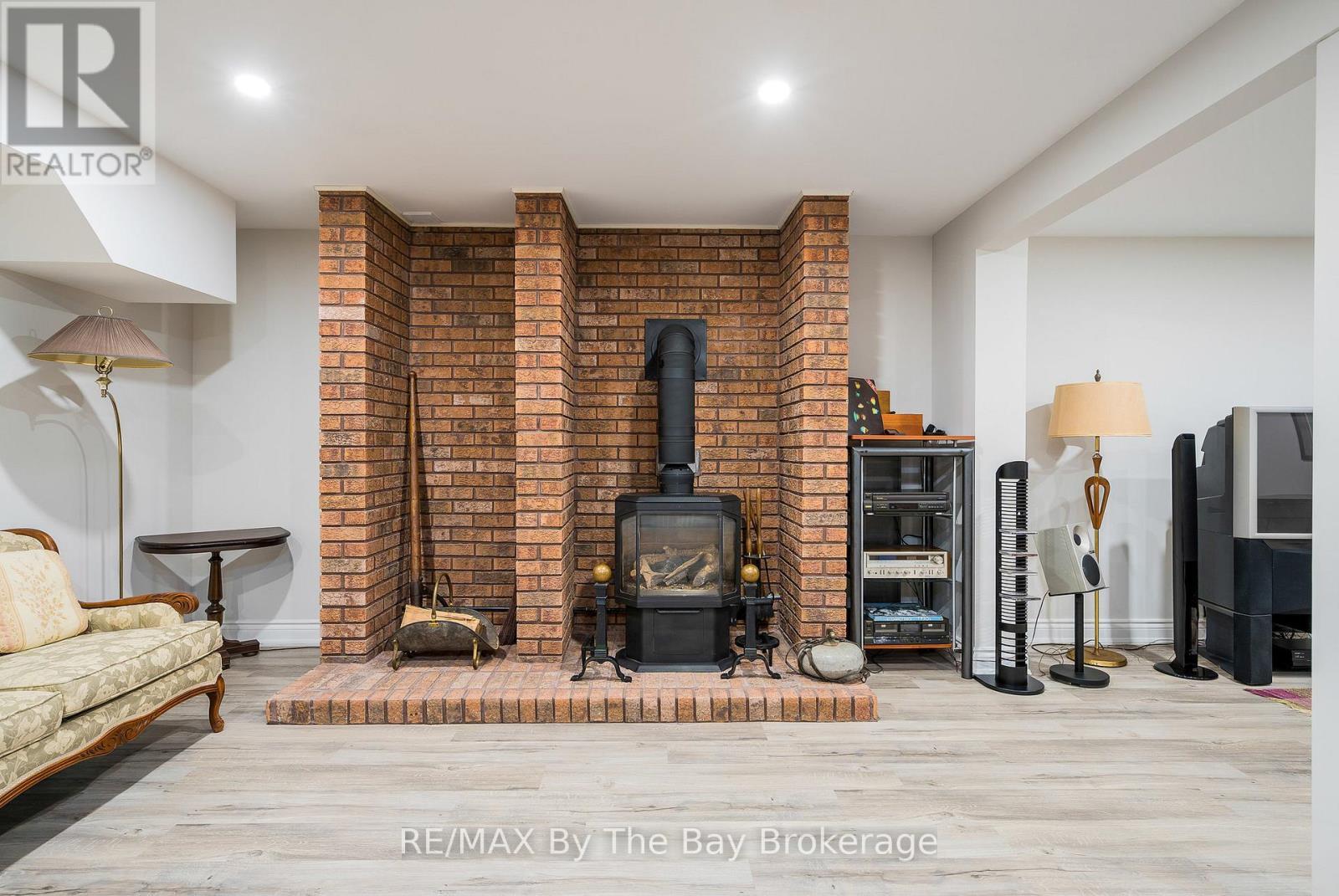 38 Willow Drive, Tiny, ON - Indoor With Fireplace