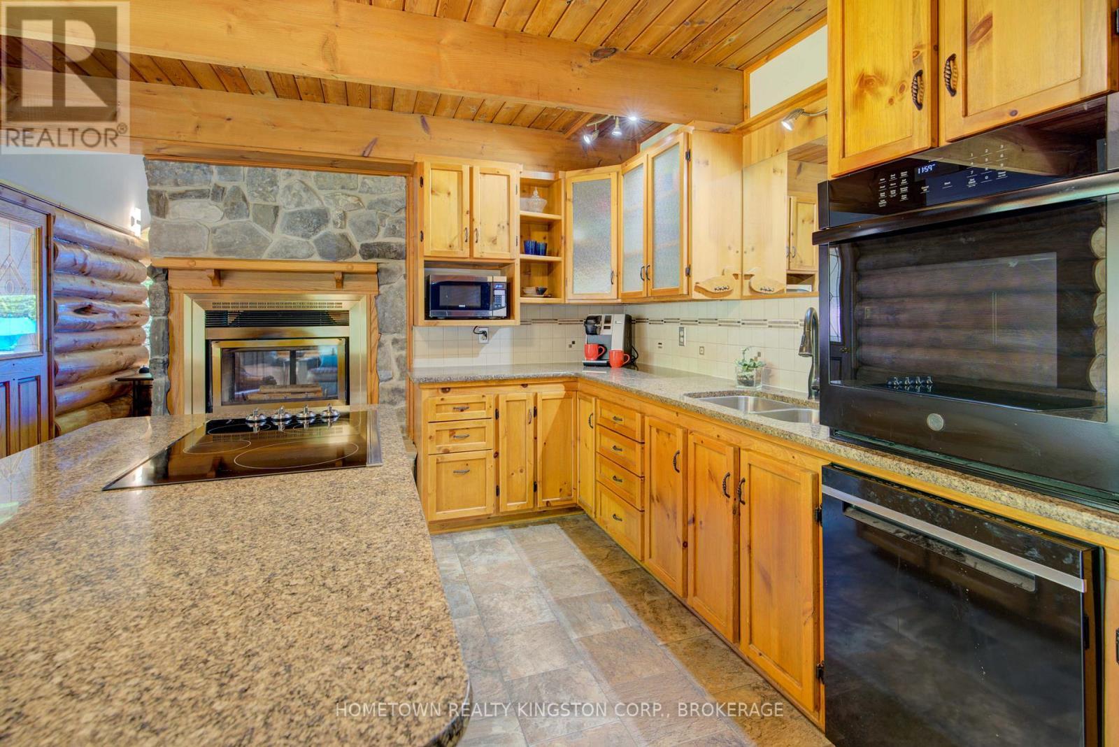199 Kelly'S Road, Rideau Lakes, ON - Indoor Photo Showing Kitchen With Fireplace With Double Sink