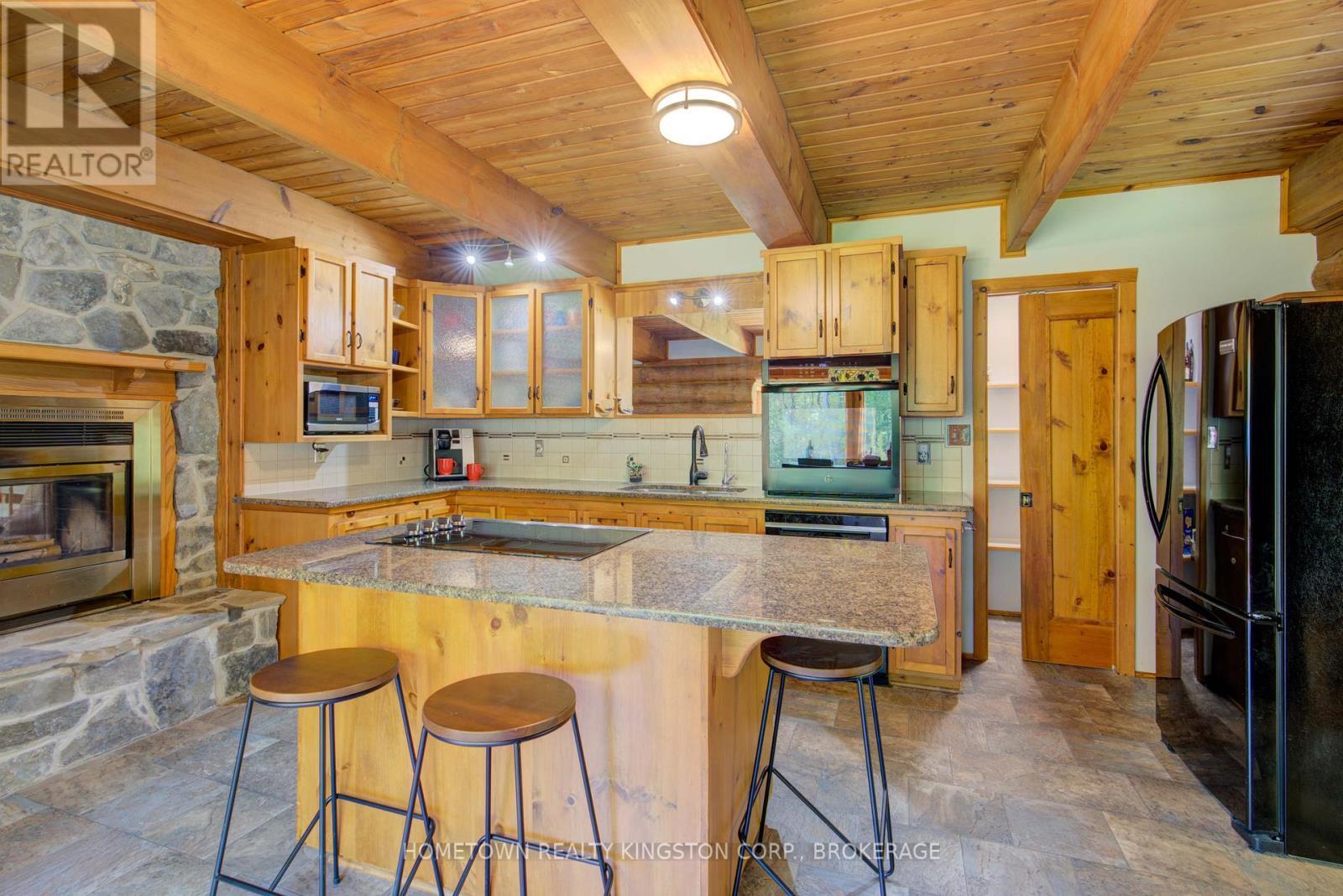 199 Kelly'S Road, Rideau Lakes, ON - Indoor Photo Showing Kitchen With Fireplace With Double Sink