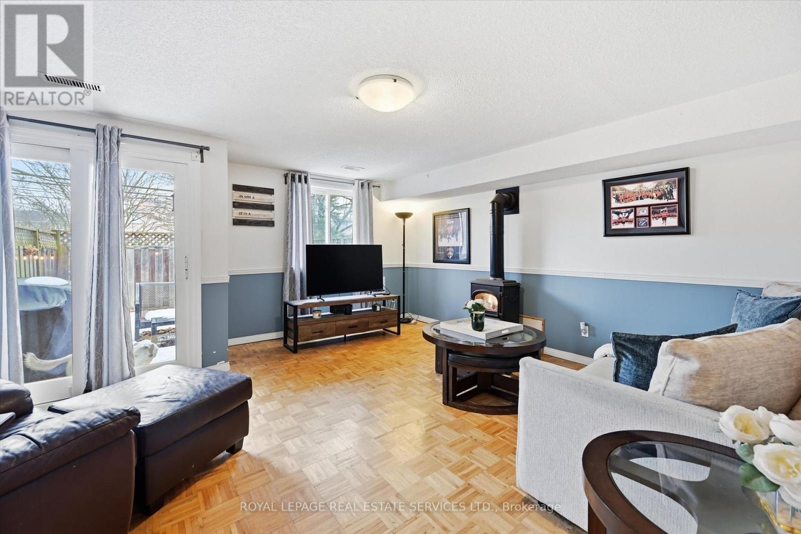 Family Room with a Sliding Door Walkout to Patio - 51 - 26 Moss Boulevard, Hamilton, ON - Indoor Photo Showing Living Room