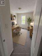 Bedroom virtually staged as office -