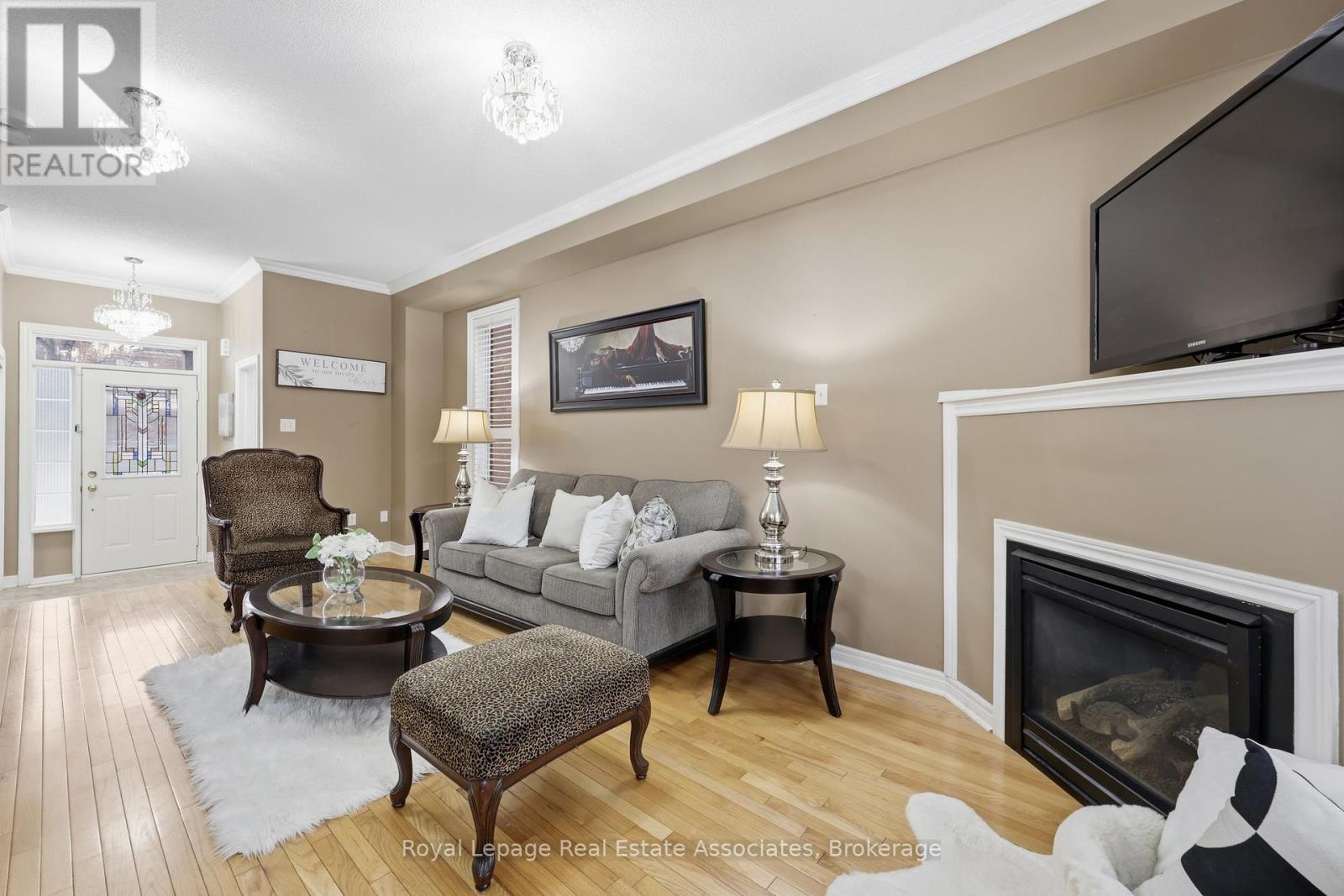 Living/Family with Gas Fireplace - 26 Prebble Drive, Markham, ON - Indoor Photo Showing Living Room With Fireplace