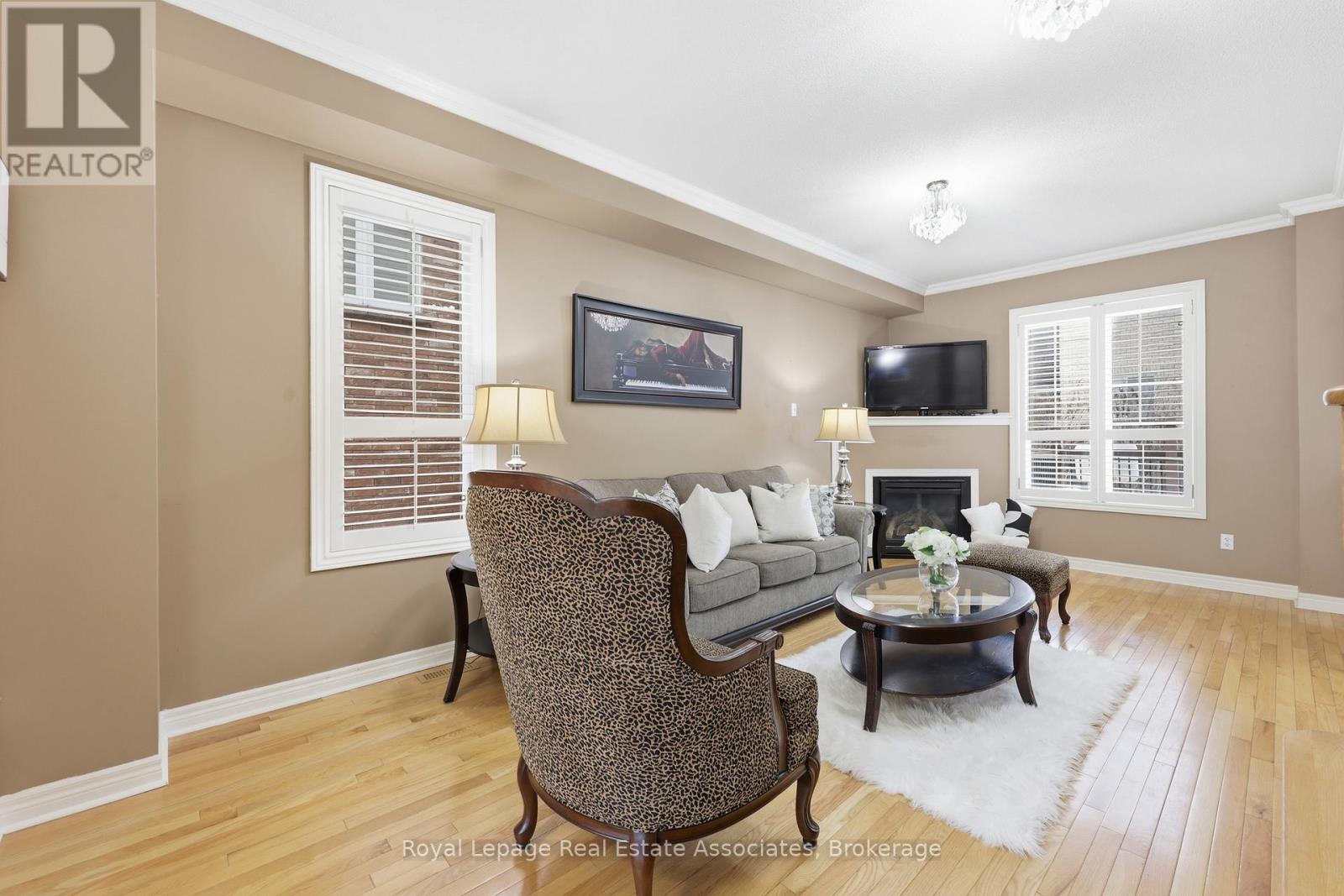 Living/Family with Gas Fireplace - 26 Prebble Drive, Markham, ON - Indoor Photo Showing Living Room With Fireplace