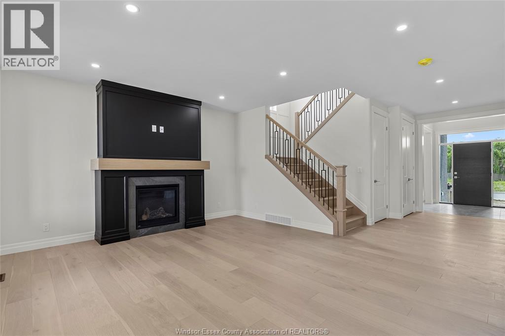 267 Joan Flood, Essex, ON - Indoor Photo Showing Living Room With Fireplace