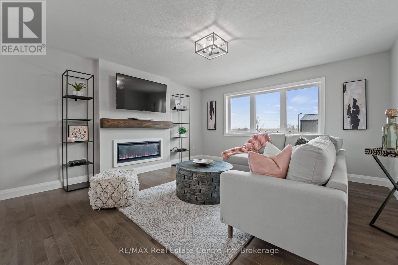 Photo is representation of Builders work - 190 Bridge Crescent, Minto, ON - Indoor Photo Showing Living Room With Fireplace