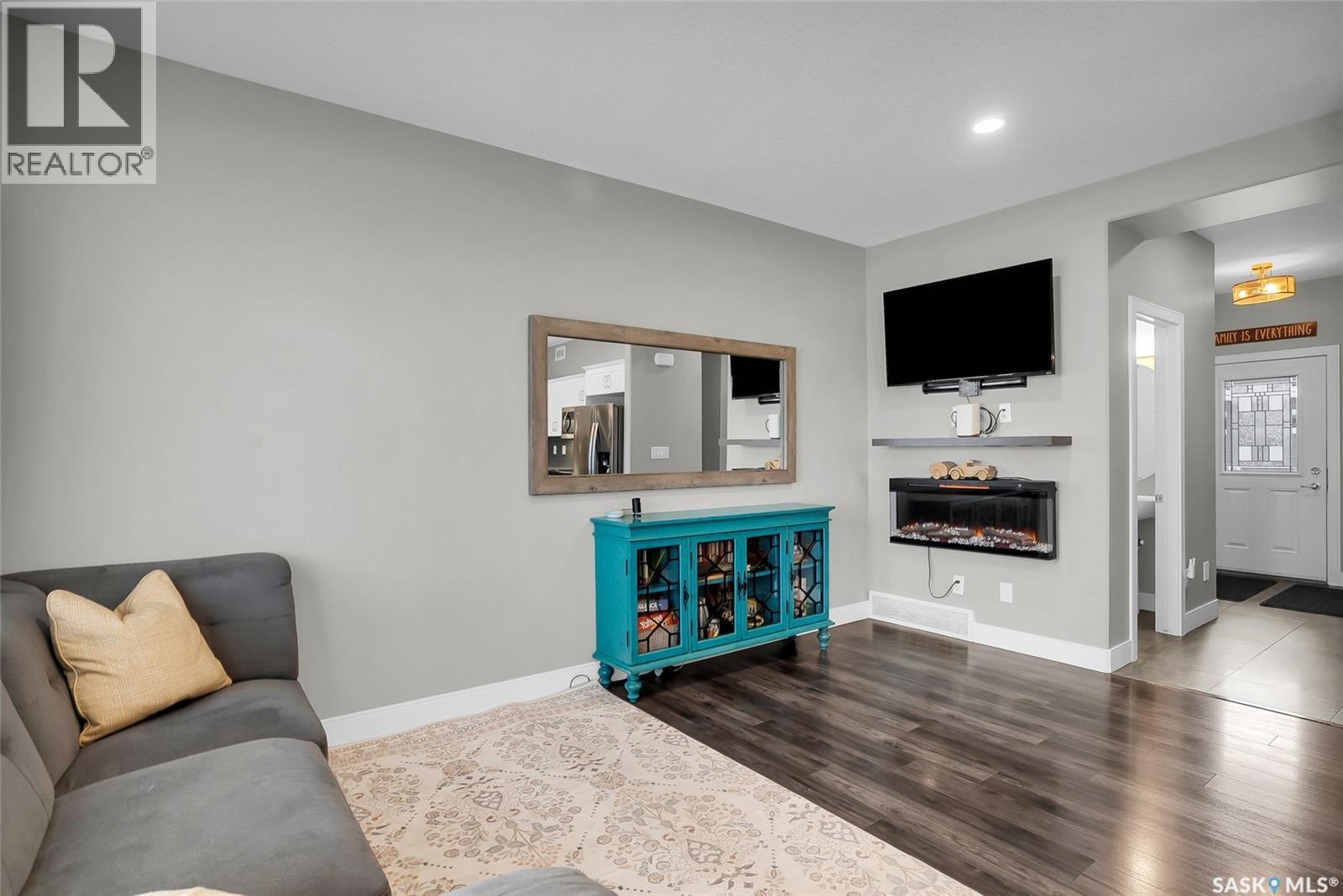 22 115 Veltkamp Crescent, Saskatoon, SK - Indoor Photo Showing Other Room With Fireplace