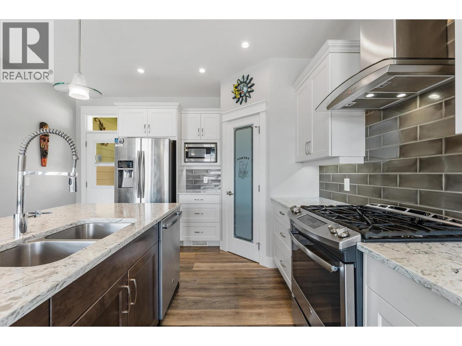 Gas Range - 2600 Paramount Drive, West Kelowna, BC - Indoor Photo Showing Kitchen With Stainless Steel Kitchen With Double Sink With Upgraded Kitchen