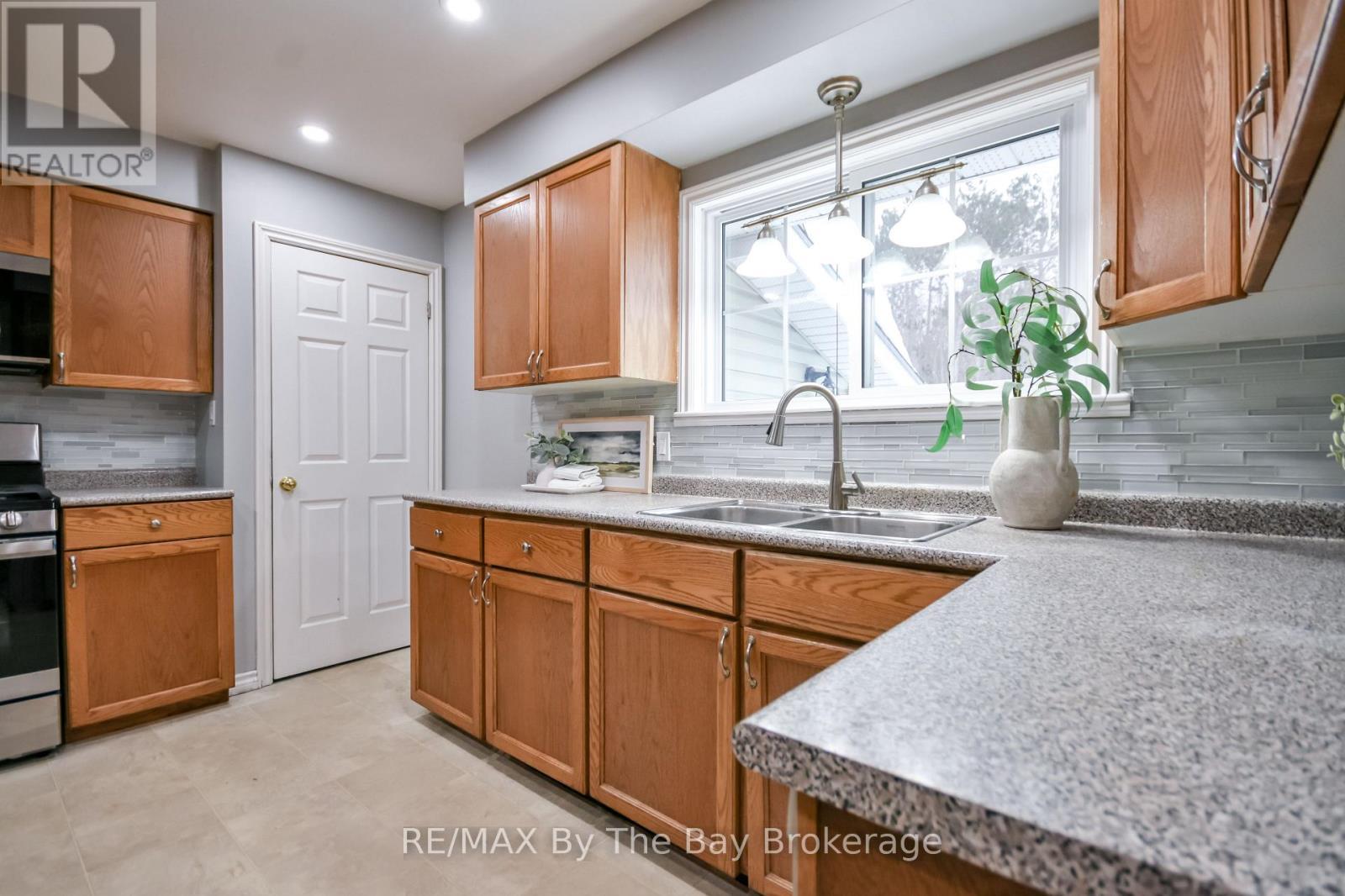111 Balm Beach Road E, Tiny, ON - Indoor Photo Showing Kitchen With Double Sink