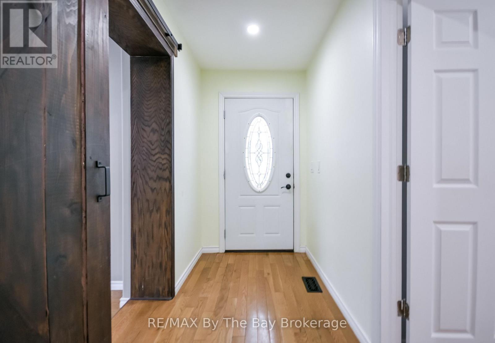 Separate Entrance - 111 Balm Beach Road E, Tiny, ON - Indoor Photo Showing Other Room