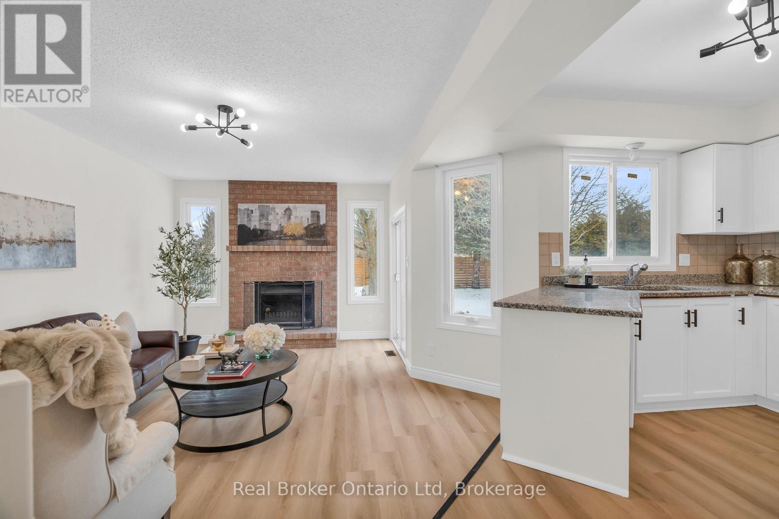 1 Balfour Court, Guelph (Kortright East), ON - Indoor With Fireplace