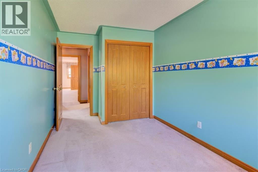 Upper Bedroom 3: closet provides practical storage for clothing, shoes, and seasonal items. - 42 Donly Drive S Unit# 2, Simcoe, ON - Indoor Photo Showing Other Room