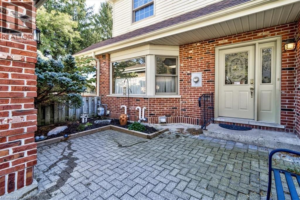 A serene courtyard, perfect for morning coffee or relaxing after a stroll to the nearby park. - 42 Donly Drive S Unit# 2, Simcoe, ON - Outdoor