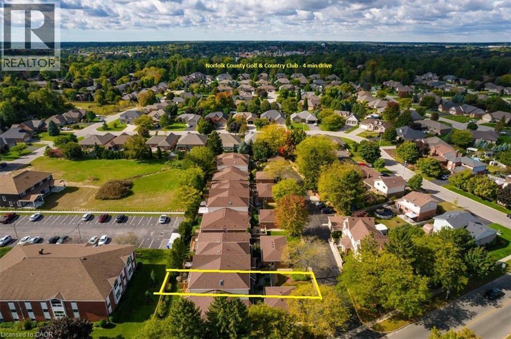 Golf enthusiasts will love being close to the Norfolk Golf & Country Club, just a short 3 minute drive away. - 42 Donly Drive S Unit# 2, Simcoe, ON - Outdoor With View