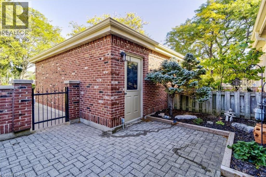 Access your private front patio easily through the garage, creating a seamless indoor-outdoor living experience. - 42 Donly Drive S Unit# 2, Simcoe, ON - Outdoor