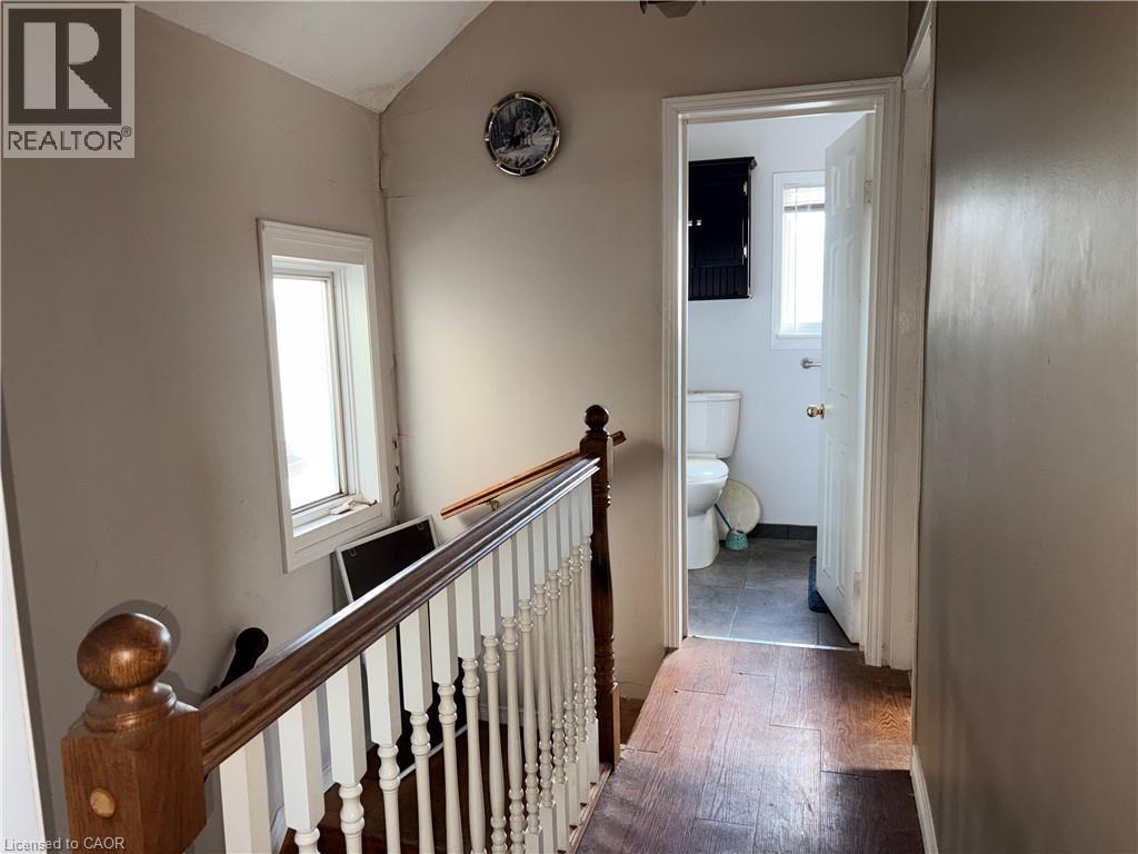 Hall featuring an upstairs landing, lofted ceiling, and wood finished floors - 14 Carlisle Street, Hamilton, ON - Indoor Photo Showing Other Room