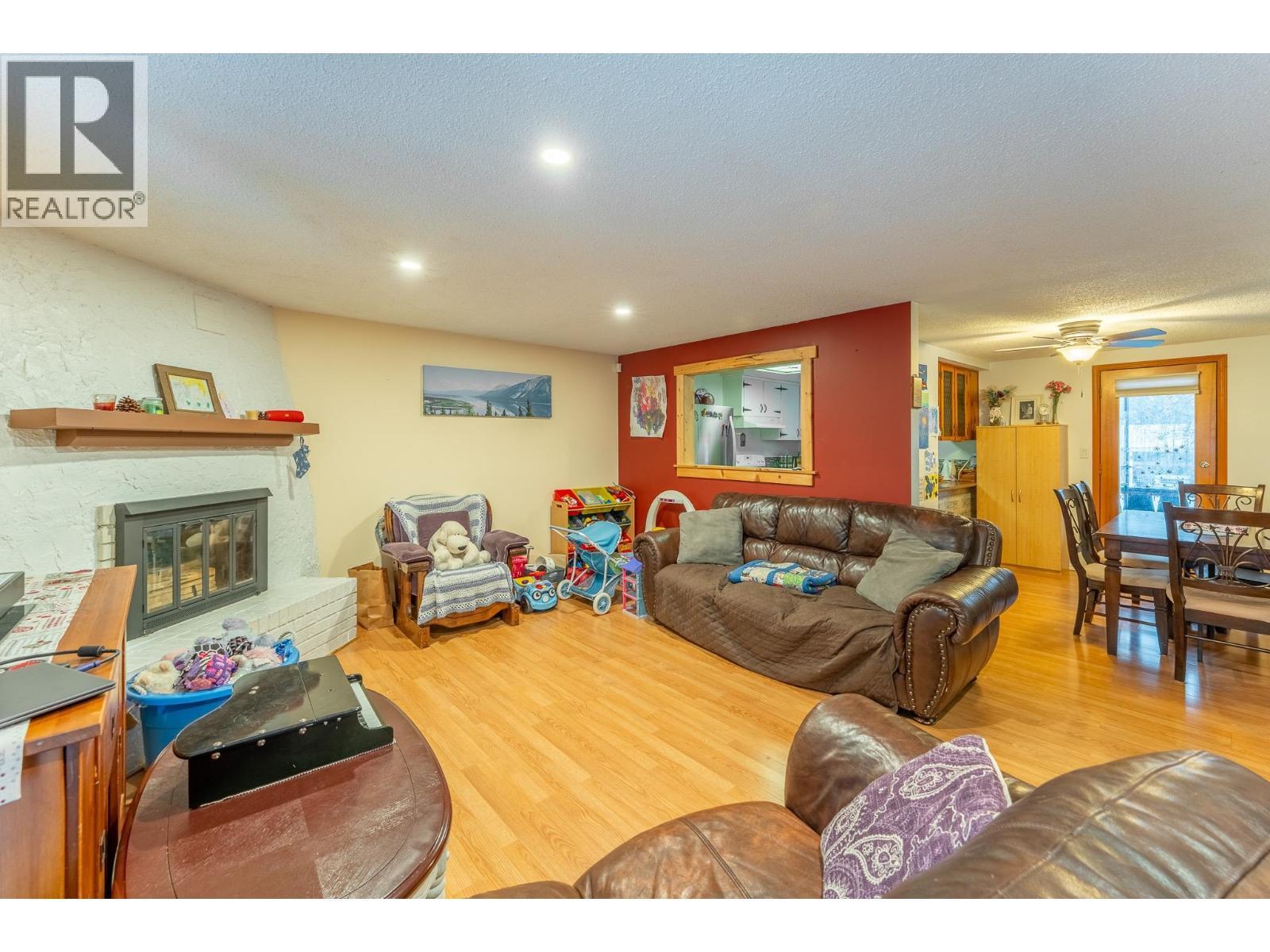 660 Pilot Street, Prince George, BC - Indoor Photo Showing Living Room With Fireplace