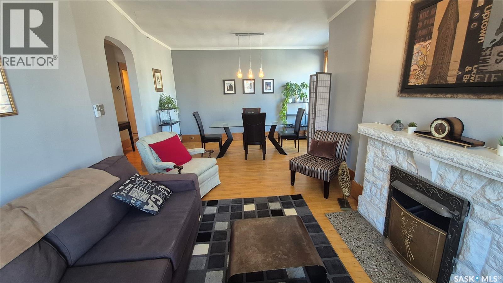 12 2201 14Th Avenue, Regina, SK - Indoor Photo Showing Living Room With Fireplace