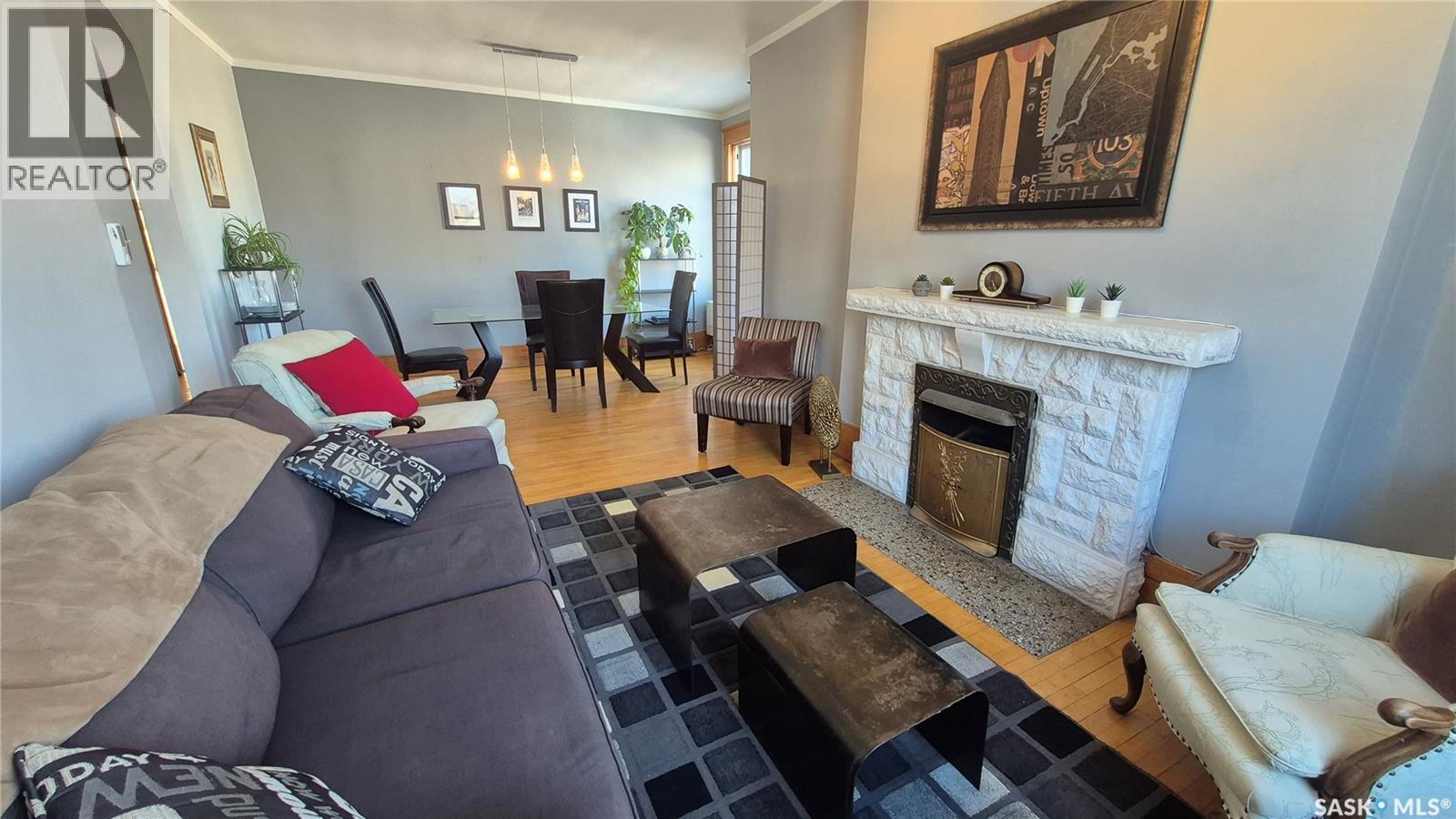 12 2201 14Th Avenue, Regina, SK - Indoor Photo Showing Living Room With Fireplace
