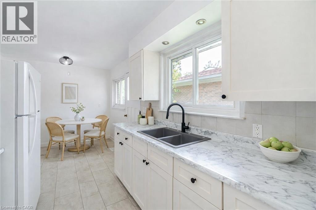 Virtually staged - 1093 Parthia Crescent, Mississauga, ON - Indoor Photo Showing Kitchen With Double Sink