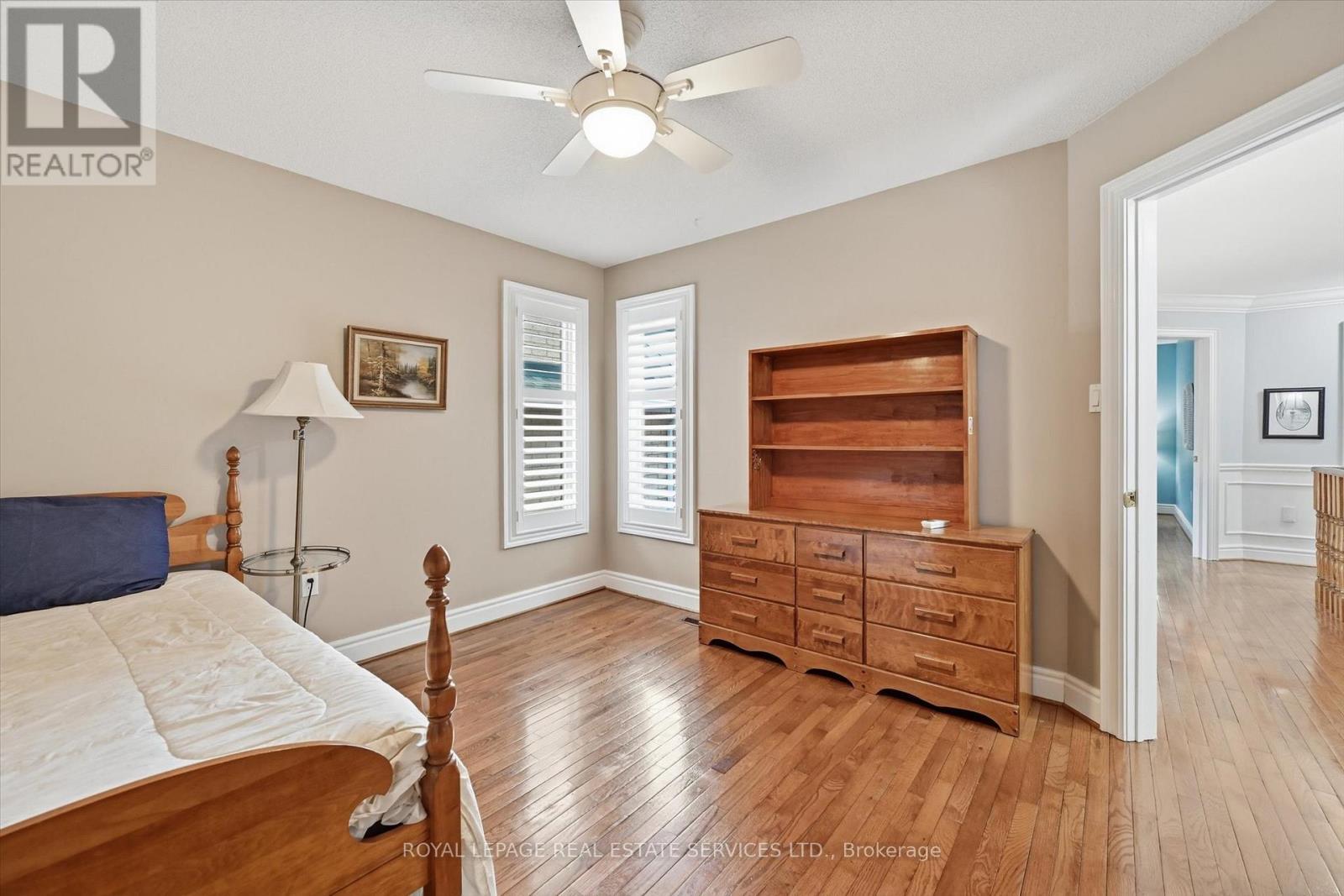 Fifth Bedroom Features Hardwood Flooring - 2017 Peak Place, Oakville, ON - Indoor Photo Showing Bedroom