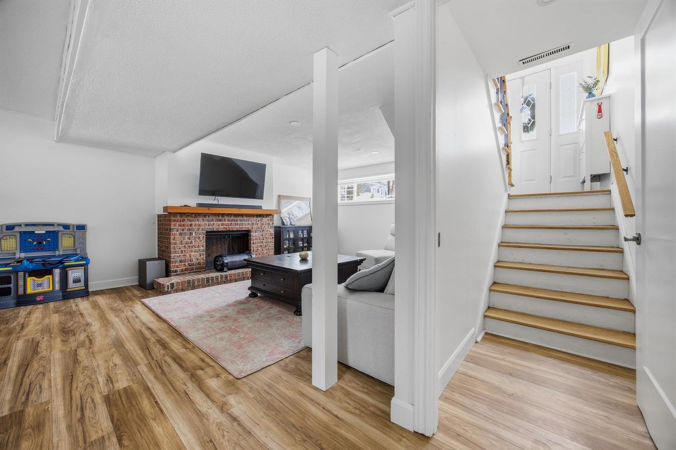 Basement - 38 Rue De Tarragone, Kirkland, QC - Indoor With Fireplace