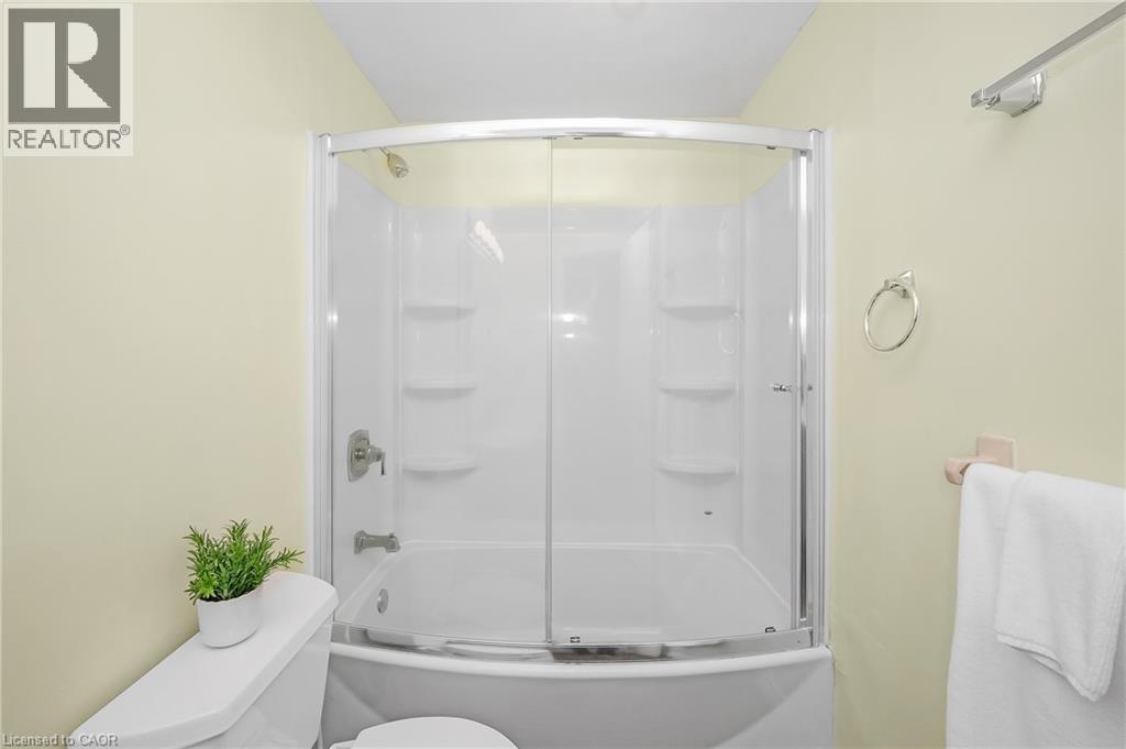 Bath w/combo bath/shower + glass door - 375 Kingscourt Drive Unit# 21, Waterloo, ON - Indoor Photo Showing Bathroom