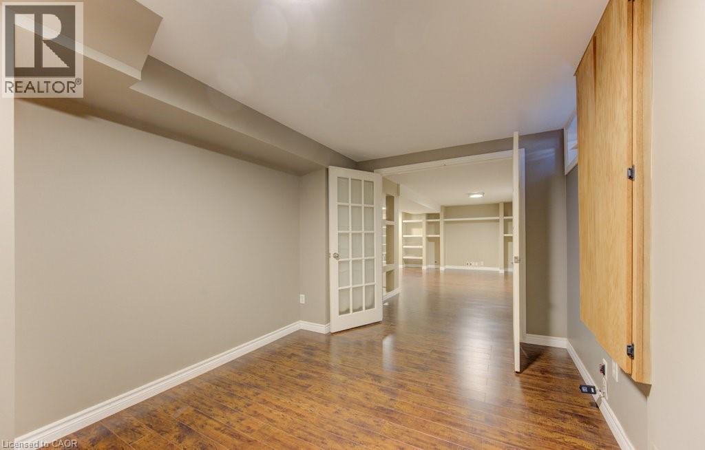 french doors - 404 Wake Robin Crescent, Kitchener, ON - Indoor Photo Showing Other Room
