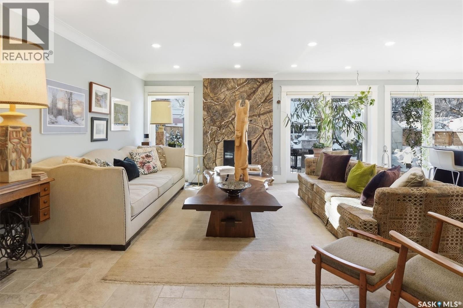 1210 Elliott Street, Saskatoon, SK - Indoor Photo Showing Living Room With Fireplace