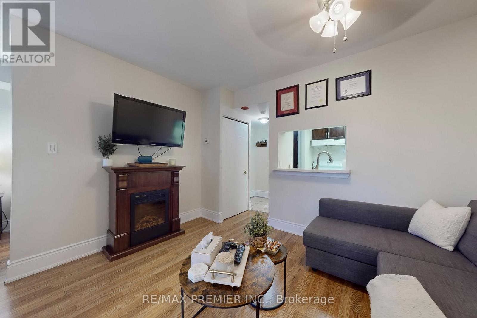 127 - 8351 Mclaughlin Road, Brampton, ON - Indoor Photo Showing Living Room With Fireplace