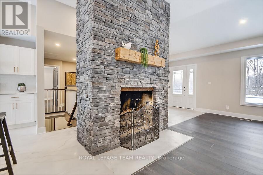 6636 Marina Drive, Ottawa, ON - Indoor Photo Showing Living Room With Fireplace