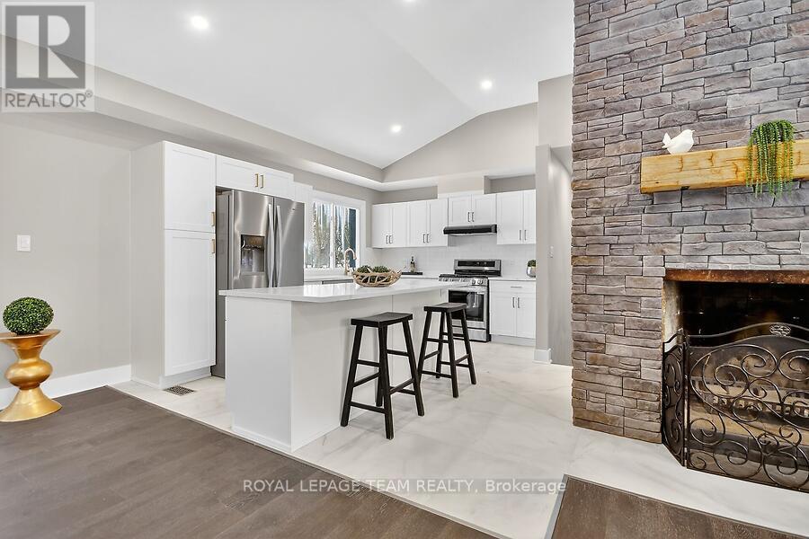 6636 Marina Drive, Ottawa, ON - Indoor Photo Showing Kitchen With Fireplace