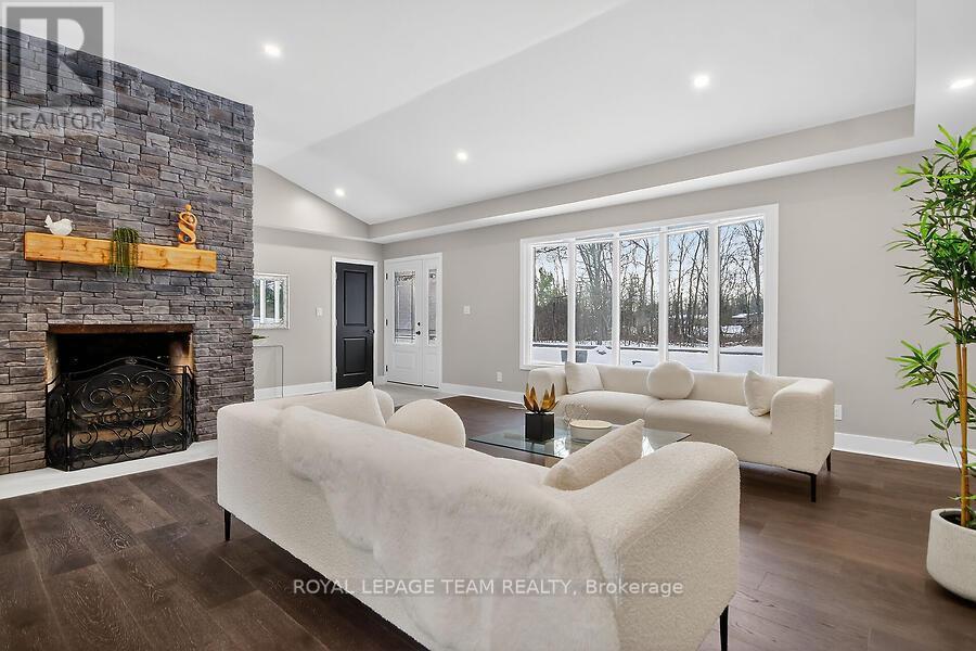 6636 Marina Drive, Ottawa, ON - Indoor Photo Showing Living Room With Fireplace