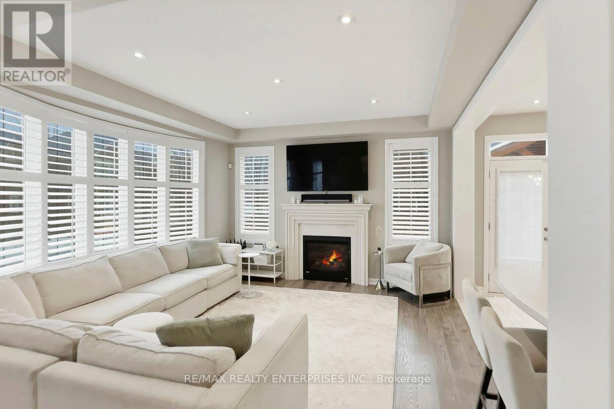 355 Wisteria Way, Oakville, ON - Indoor Photo Showing Living Room With Fireplace