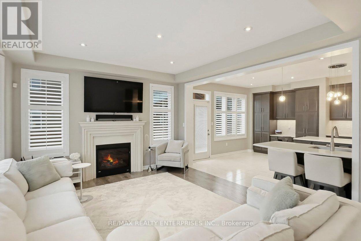 355 Wisteria Way, Oakville, ON - Indoor Photo Showing Living Room With Fireplace