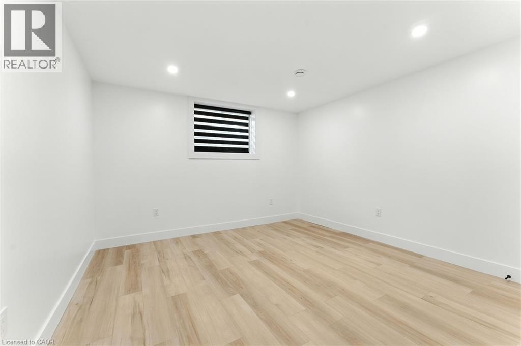 Unfurnished room with light wood-type flooring and recessed lighting - 9 Macneil Court, Port Burwell, ON - Indoor Photo Showing Other Room