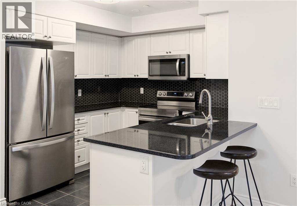 1045 Nadalin Heights Unit# 108, Milton, ON - Indoor Photo Showing Kitchen With Stainless Steel Kitchen