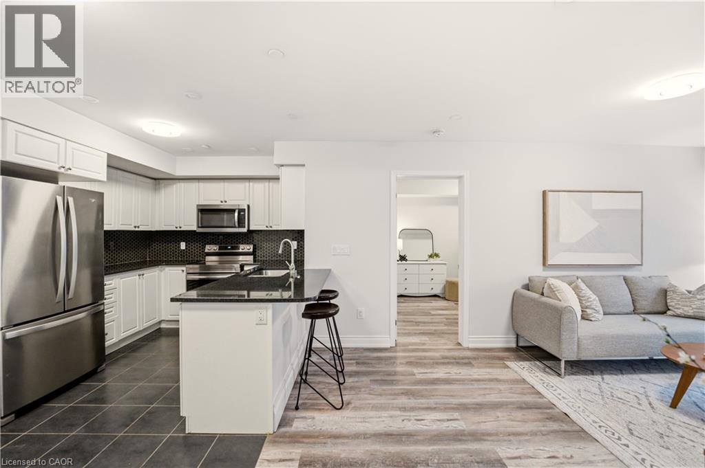1045 Nadalin Heights Unit# 108, Milton, ON - Indoor Photo Showing Kitchen With Stainless Steel Kitchen With Double Sink