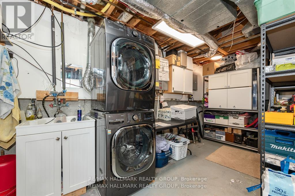 Photo Virtually Staged - 51 - 1803 Lamoureux Drive, Ottawa, ON - Indoor Photo Showing Laundry Room