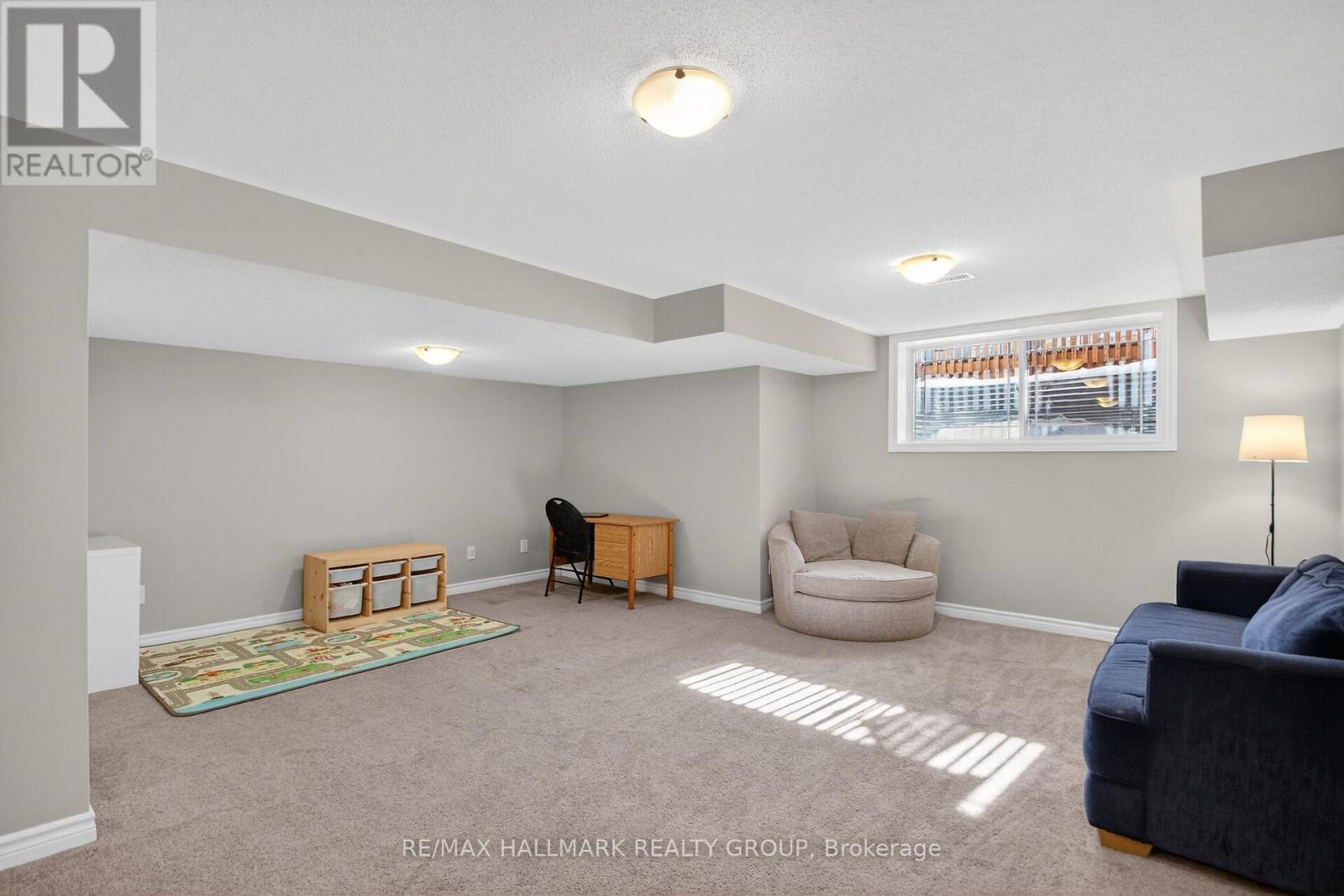 Lower level family room with oversized window. - 457 Barrick Hill Road, Ottawa, ON - Indoor